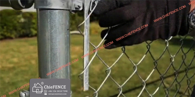 Chain link mesh must be pulled taut or it will sag. Stretching is done with a tool called a fence puller (A). Note location of the tension bar (B).
Insert a pull bar through the unattached mesh a few feet from the final post (C).
Attach the yoke to the pull bar.